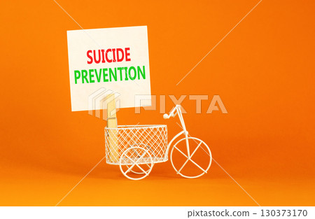 Suicide prevention symbol. Concept words Suicide prevention on beautiful white paper on clothespin. Beautiful orange table orange background. Psychological and suicide prevention concept. Copy space. Suicide prevention symbol. Concept words Suicide prevention on beautiful white paper on clothespin. Beautiful orange table orange background. Psychological and suicide prevention concept. Copy space. 130373170