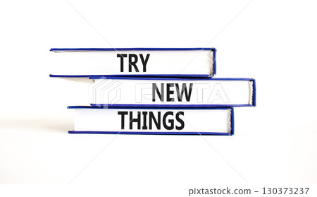 Try new things symbol. Concept words Try new things on beautiful books. Beautiful white paper background. Business motivational lifestyle try new things concept. Copy space. Try new things symbol. Concept words Try new things on beautiful books. Beautiful white paper background. Business motivational lifestyle try new things concept. Copy space. 130373237