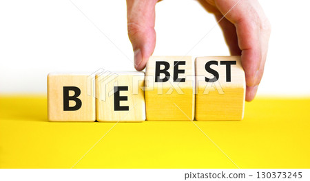Motivational and inspirational be best symbol. Concept words Be best on beautiful wooden block. Beautiful white background Businessman hand. Business motivational be best concept. Copy space. 130373245