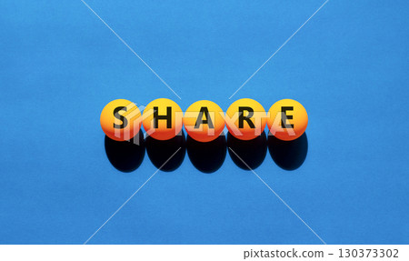 Share symbol. Concept word Share on beautiful yellow tennis ping pong balls. Beautiful wooden table wooden background. Business lifestyle share concept. Copy space. Share symbol. Concept word Share on beautiful yellow tennis ping pong balls. Beautiful wooden table wooden background. Business lifestyle share concept. Copy space. 130373302