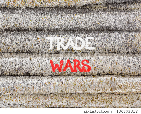 Trade wars symbol. Concept word Trade wars on beautiful grey mountain wall. Beautiful grey mountain wall background. Business trade wars concept. Copy space. 130373318