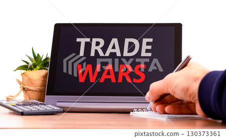 Trade wars symbol. Concept word Trade wars on beautiful black tablet. Businessman's hand with pen. Calculator. Beautiful white background. Business trade wars concept. Copy space. Trade wars symbol. Concept word Trade wars on beautiful black tablet. Businessman's hand with pen. Calculator. Beautiful white background. Business trade wars concept. Copy space. 130373361