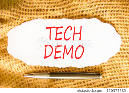 Tech demo symbol. Concept word Tech demo on beautiful white paper. Beautiful canvas background. Black pen. Business tech demo concept. Copy space. 130373383