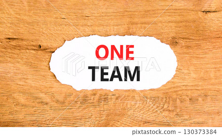 One team symbol. Concept word One team on beautiful white paper. Beautiful wooden paper background. Business one team concept. Copy space. 130373384