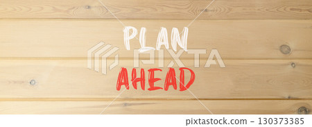 Plan ahead symbol. Concept word Plan ahead on beautiful wooden wall. Beautiful wooden wall background. Business plan ahead concept. Copy space. 130373385