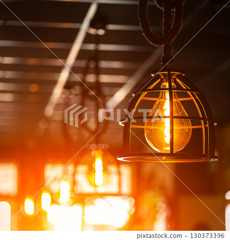 Blinds in a restaurant catching the sunlight with burst light 130373396