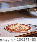 The chef prepares pizza. Raw pizza ready to oven 130373463