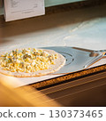 The chef prepares pizza. Raw pizza ready to oven 130373465
