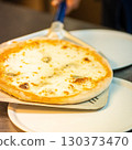 real Neapolitan Italian pizza called margherita pizza just out of the oven 130373470