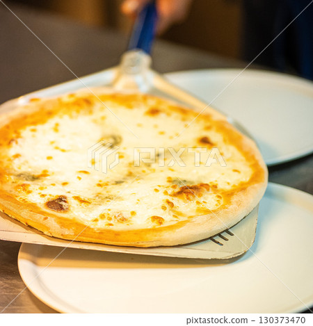 real Neapolitan Italian pizza called margherita pizza just out of the oven real Neapolitan Italian pizza called margherita pizza just out of the oven 130373470