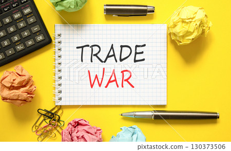 Trade war symbol. Concept word Trade war on beautiful white note. Black calculator. Black pen. Beautiful yellow paper background. Business trade war concept. Copy space. 130373506