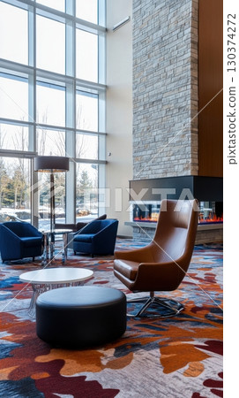 Cozy lounge area with large windows Cozy lounge area with large windows 130374272