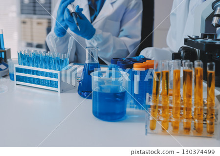 Collaboration, tablet or science with people in lab together for research or development. Innovation, tech and microscope with scientist team in clinical trial for planning or medical investigation Collaboration, tablet or science with people in lab together for research or development. Innovation, tech and microscope with scientist team in clinical trial for planning or medical investigation 130374499