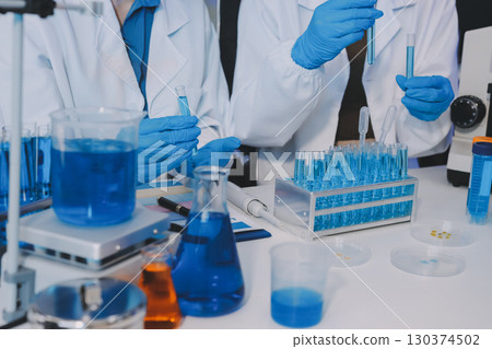 Collaboration, tablet or science with people in lab together for research or development. Innovation, tech and microscope with scientist team in clinical trial for planning or medical investigation Collaboration, tablet or science with people in lab together for research or development. Innovation, tech and microscope with scientist team in clinical trial for planning or medical investigation 130374502