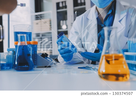 Collaboration, tablet or science with people in lab together for research or development. Innovation, tech and microscope with scientist team in clinical trial for planning or medical investigation 130374507