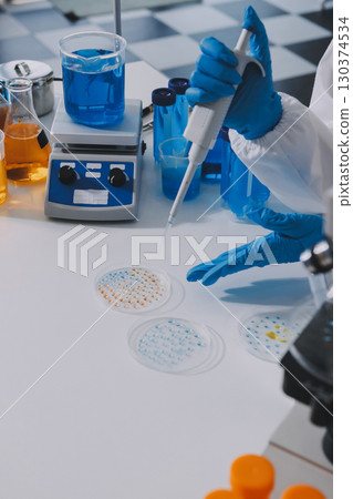 Collaboration, tablet or science with people in lab together for research or development. Innovation, tech and microscope with scientist team in clinical trial for planning or medical investigation 130374534