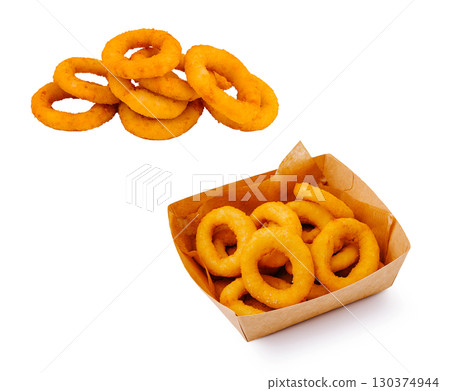 Delicious onion rings served in a paper container and on a plate Delicious onion rings served in a paper container and on a plate 130374944