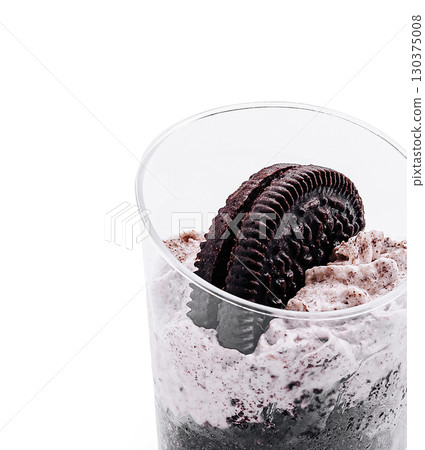 Delicious Oreo dessert served in a clear cup with whipped cream topping Delicious Oreo dessert served in a clear cup with whipped cream topping 130375008