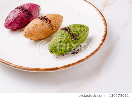 Trio of colorful gourmet spreads served in quenelle shape on a ceramic plate Trio of colorful gourmet spreads served in quenelle shape on a ceramic plate 130375011
