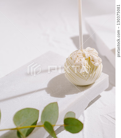 Delicate dessert on white background with floral decor and natural elements Delicate dessert on white background with floral decor and natural elements 130375081