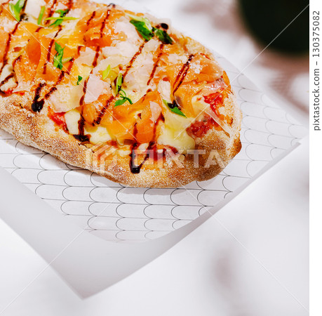 Delicious pizza with fresh toppings and sauce is ready to enjoy Delicious pizza with fresh toppings and sauce is ready to enjoy 130375082