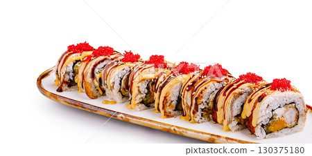 Colorful sushi rolls arranged neatly on a white platter 130375180