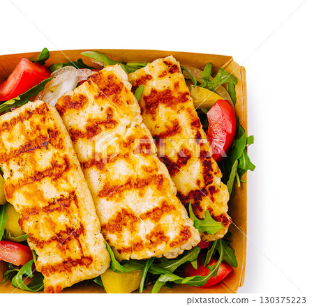 Grilled halloumi with fresh salad served in a takeout box Grilled halloumi with fresh salad served in a takeout box 130375223