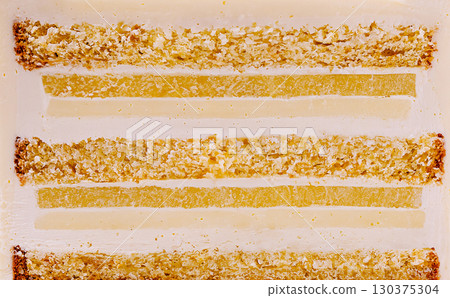 Delicate layers of citrus jelly on a white plate with a textured background Delicate layers of citrus jelly on a white plate with a textured background 130375304