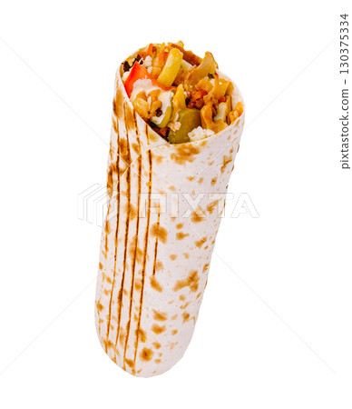 Delicious vegetarian wrap filled with fresh vegetables and spices Delicious vegetarian wrap filled with fresh vegetables and spices 130375334