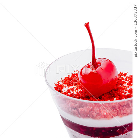 Delicious dessert with cherry and red sweet topping on whipped cream 130375337