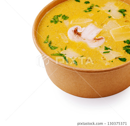 Delicious creamy soup served in a bowl with fresh herbs and vegetables Delicious creamy soup served in a bowl with fresh herbs and vegetables 130375371