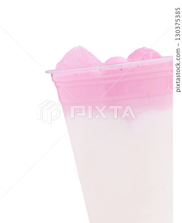 Refreshing pink drink served in a clear cup with ice on a sunny day Refreshing pink drink served in a clear cup with ice on a sunny day 130375385