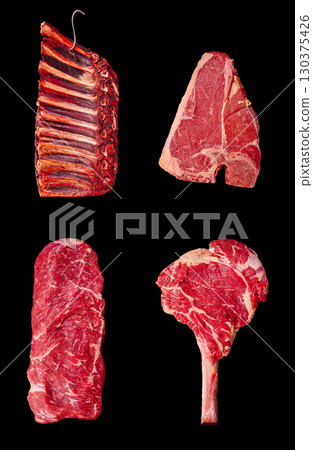 Different cuts of fresh meat displayed on a dark background 130375426