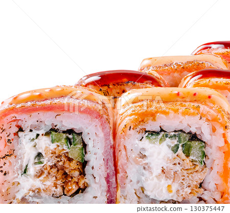 Colorful sushi rolls arranged on a white background with fresh ingredients 130375447