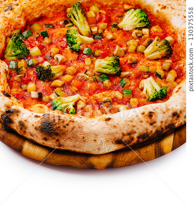 Delicious vegetable pizza with fresh toppings and golden crust Delicious vegetable pizza with fresh toppings and golden crust 130375558