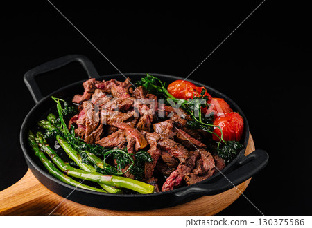 Delicious beef stir fry with fresh vegetables and vibrant colors Delicious beef stir fry with fresh vegetables and vibrant colors 130375586