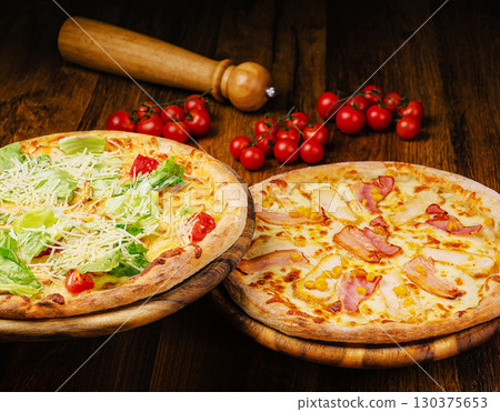 Cozy restaurant serving delicious pizzas on wooden boards Cozy restaurant serving delicious pizzas on wooden boards 130375653