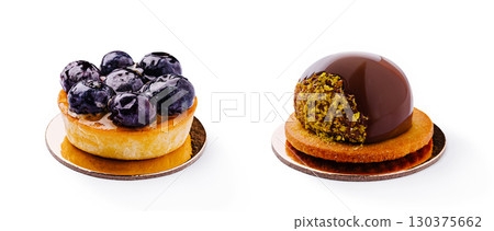 Rich dessert tarts with blueberries and chocolate on a clean white background Rich dessert tarts with blueberries and chocolate on a clean white background 130375662