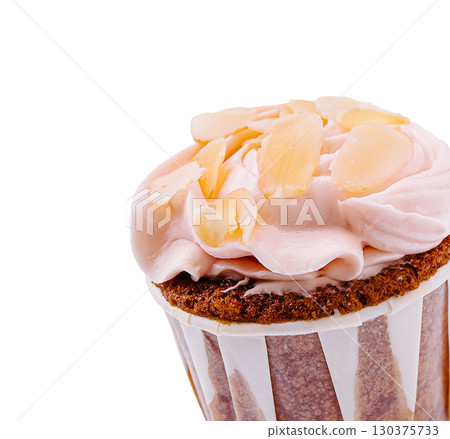 Sweet cupcake with almond flakes and pink frosting on a white background Sweet cupcake with almond flakes and pink frosting on a white background 130375733