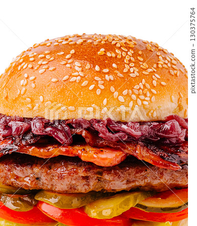 Juicy burger with bacon and toppings served in a sesame seed bun 130375764