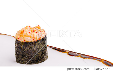 Fresh sushi roll prepared with seafood in a minimalistic setting 130375868