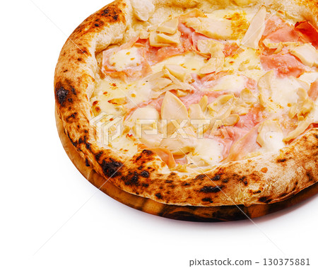 Delicious homemade pizza topped with cheese and ham on a wooden platter 130375881
