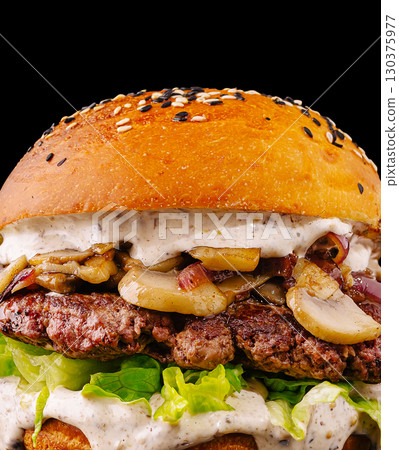 Delicious burger with grilled mushrooms and fresh lettuce on black background 130375977