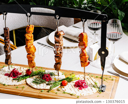 Grilled skewers served with fresh tortillas at a fine dining restaurant 130376015