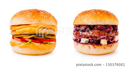 Two tasty burgers with cheese and fruit on sesame seed buns Two tasty burgers with cheese and fruit on sesame seed buns 130376081