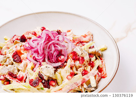 Colorful salad with fresh ingredients and garnished onions at lunchtime Colorful salad with fresh ingredients and garnished onions at lunchtime 130376119