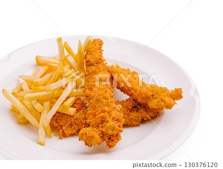 Crispy chicken or shrimp tenders with golden fries served on a white plate Crispy chicken or shrimp tenders with golden fries served on a white plate 130376120