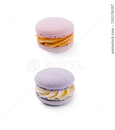Colorful macarons on a white background showcasing delightful pastry details Colorful macarons on a white background showcasing delightful pastry details 130376207