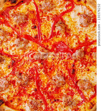 Delicious pizza topped with sausage and red peppers ready to be enjoyed Delicious pizza topped with sausage and red peppers ready to be enjoyed 130376232