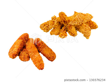 Crispy fried chicken tenders stacked on a white surface with golden color Crispy fried chicken tenders stacked on a white surface with golden color 130376234